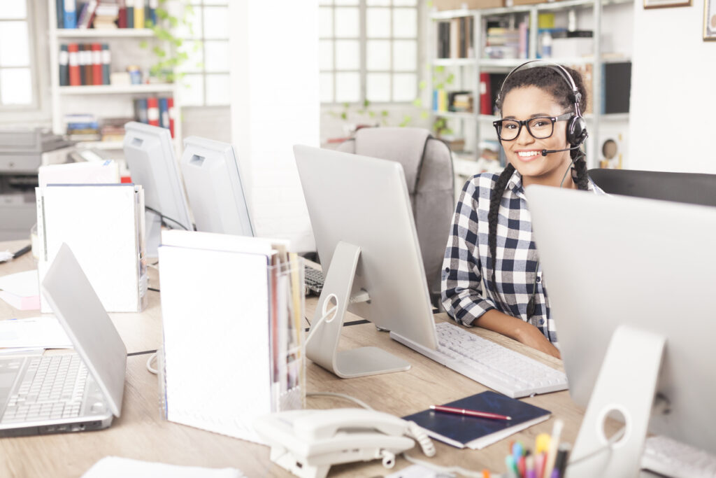 Young female call center operator with headset
